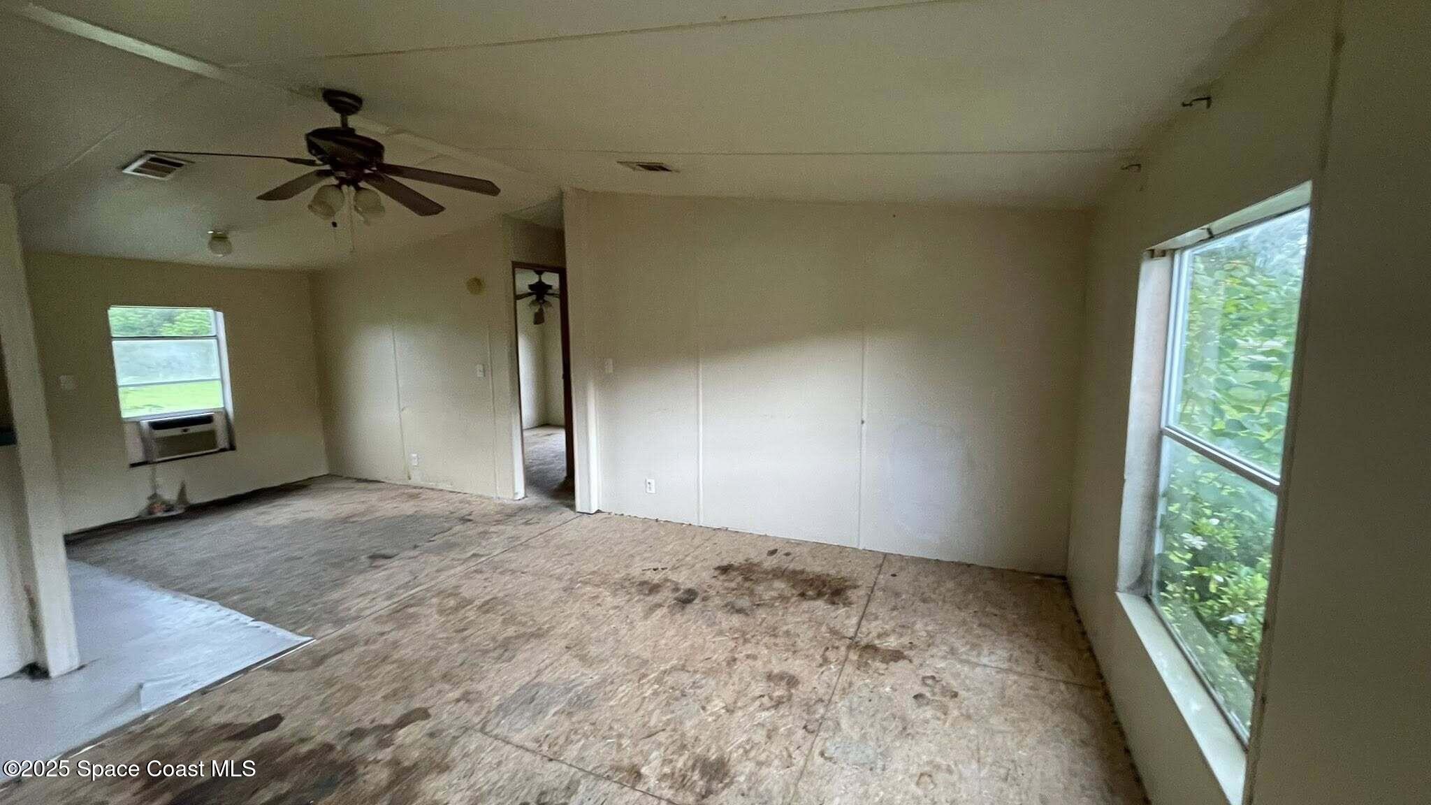 54275 Bea Road Callahan, FL 32011 - Photo 12 of 52 an empty room with windows and closet