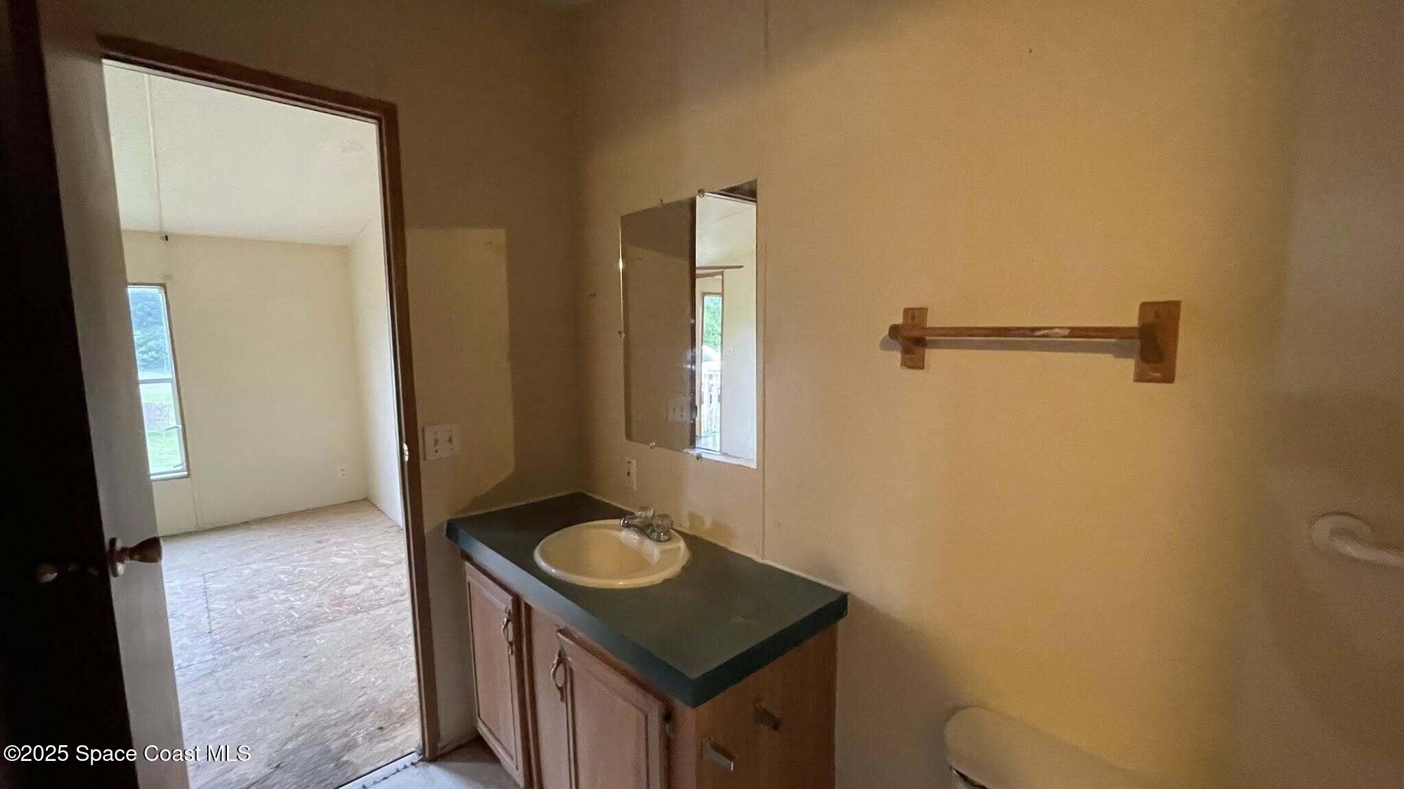 54275 Bea Road Callahan, FL 32011 - Photo 23 of 52 a bathroom with a sink toilet and shower