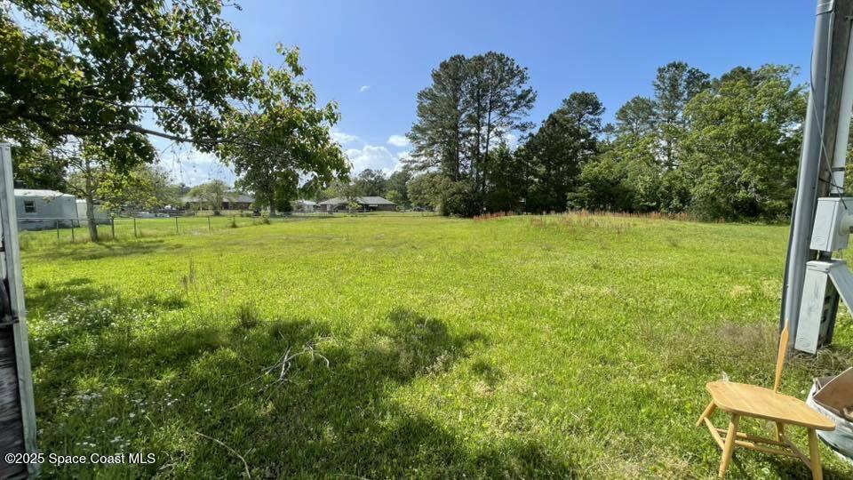 54275 Bea Road Callahan, FL 32011 - Photo 7 of 52 a view of a field with a tree