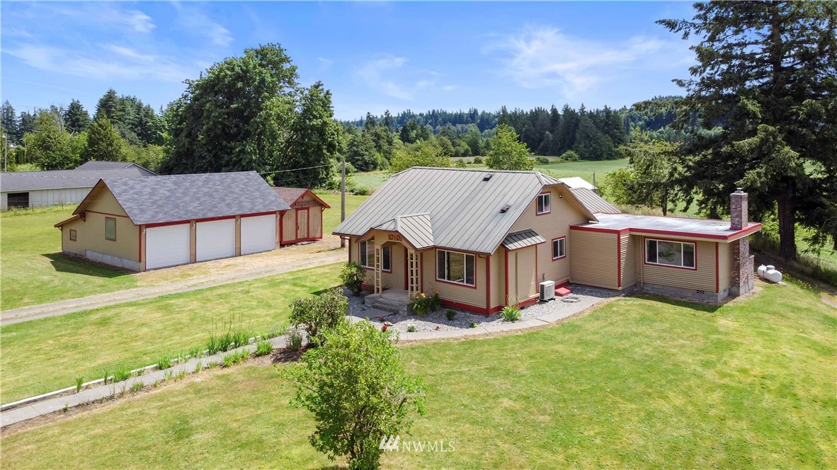 10101 James Road Southwest Rochester, WA 98579 - Photo 2 of 34 an aerial view of a house with porch yard basket ball court and trampoline
