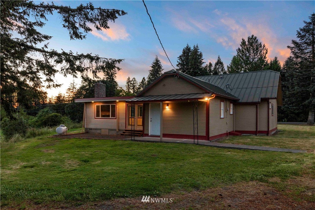 10101 James Road Southwest Rochester, WA 98579 - Photo 4 of 34 a view of a house with a yard