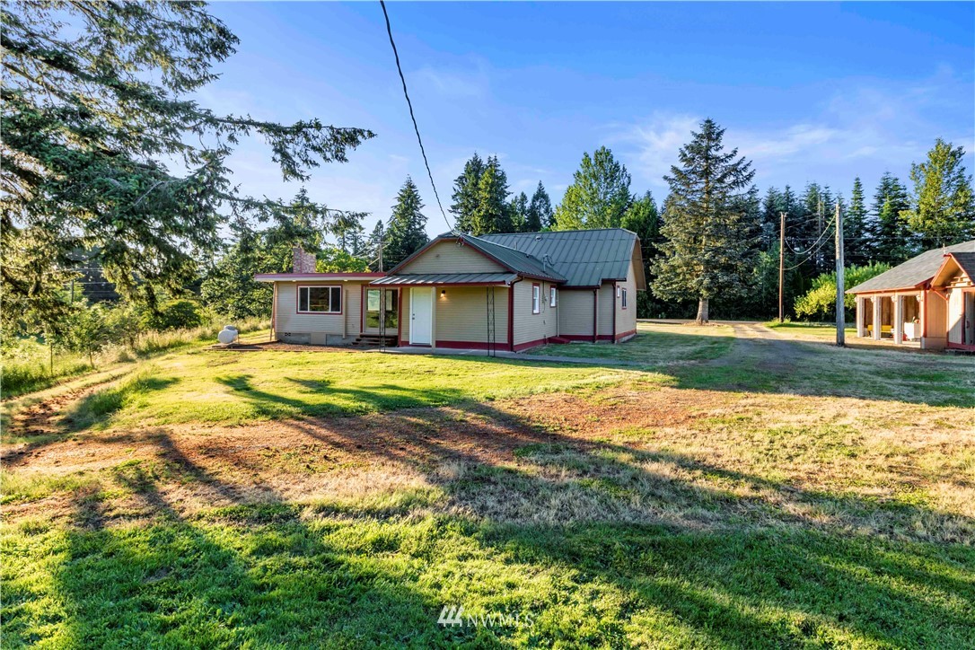 10101 James Road Southwest Rochester, WA 98579 - Photo 33 of 34 a view of a house with a swimming pool