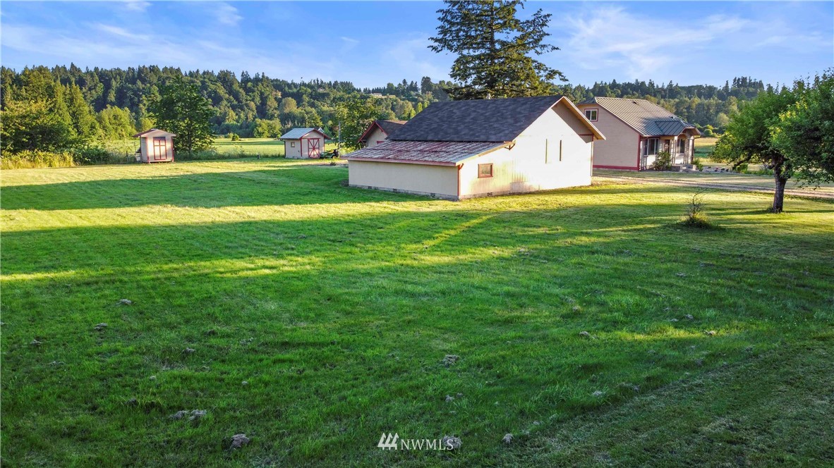 10101 James Road Southwest Rochester, WA 98579 - Photo 5 of 34 a view of a house with a yard