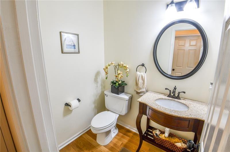 1865 Oak Tree Hollow Alpharetta, GA 30005 - Photo 13 of 35 a bathroom with a sink and a mirror