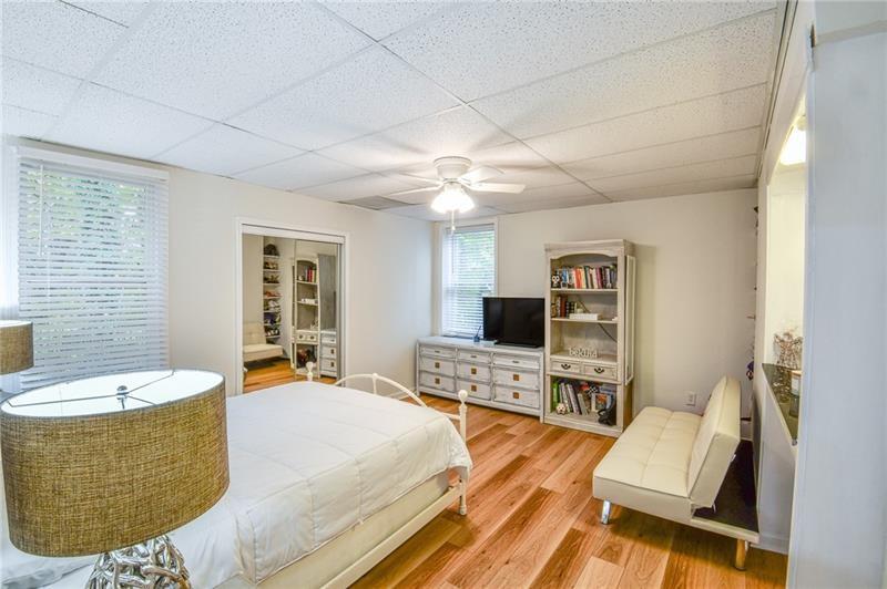 1865 Oak Tree Hollow Alpharetta, GA 30005 - Photo 26 of 35 a living room with furniture and a flat screen tv