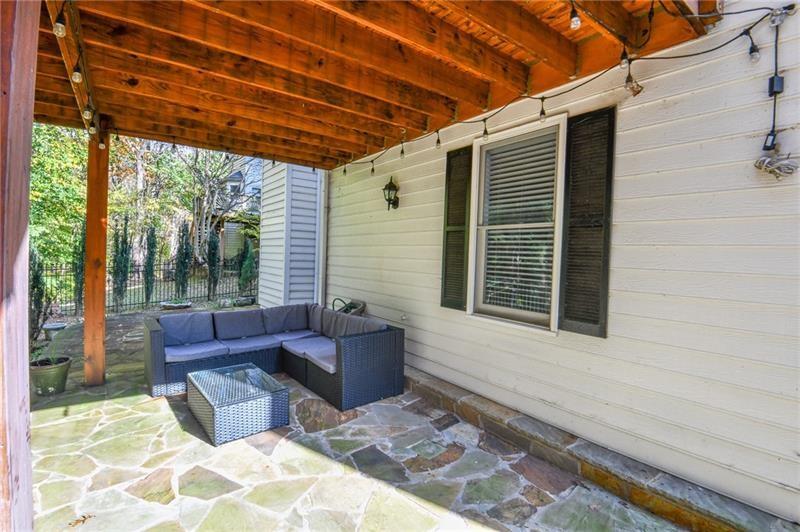 1865 Oak Tree Hollow Alpharetta, GA 30005 - Photo 31 of 35 a outdoor living space with furniture and a potted plant