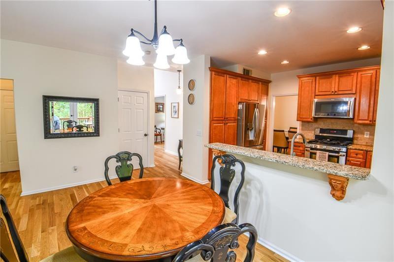 1865 Oak Tree Hollow Alpharetta, GA 30005 - Photo 9 of 35 a view of a dining room with furniture
