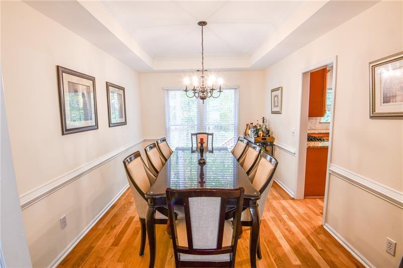 1865 Oak Tree Hollow Alpharetta, GA 30005 - Photo 10 of 35 a view of a dining room with furniture window and wooden floor