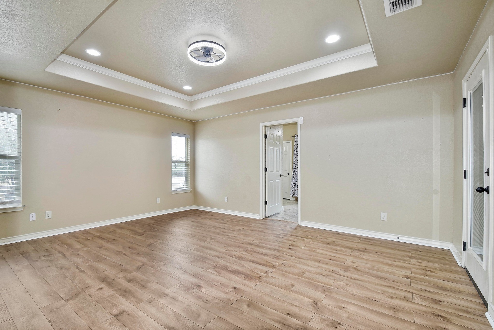 158 Pullman Road La Vernia, TX 78121 - Photo 17 of 39 wooden floor in an empty room with window and wooden floor