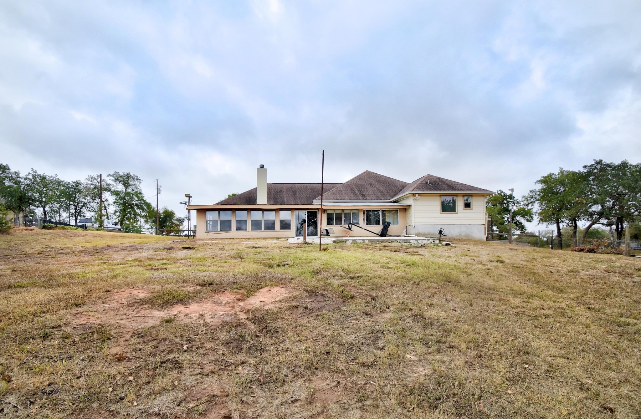158 Pullman Road La Vernia, TX 78121 - Photo 38 of 39 a front view of house with yard and trees in the background