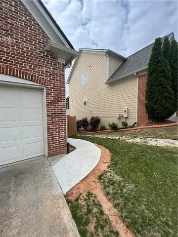 a view of a backyard of the house