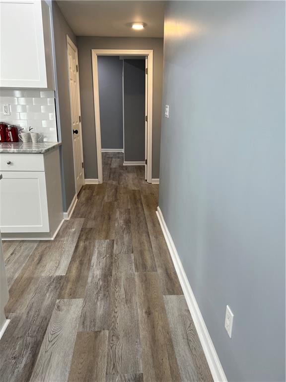 3152 Daleview Way Southwest Atlanta, GA 30331 - Photo 19 of 35 a view of a hallway with wooden floor and cabinets