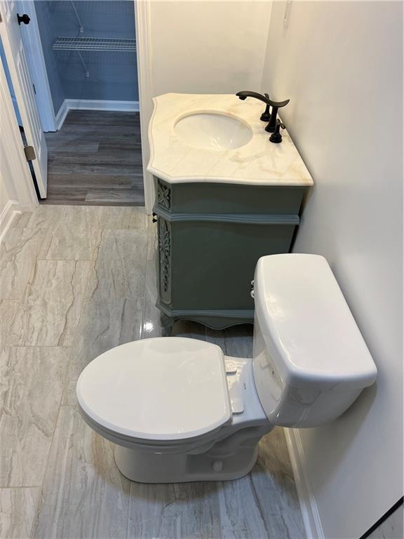 3152 Daleview Way Southwest Atlanta, GA 30331 - Photo 27 of 35 a bathroom with a toilet sink and mirror