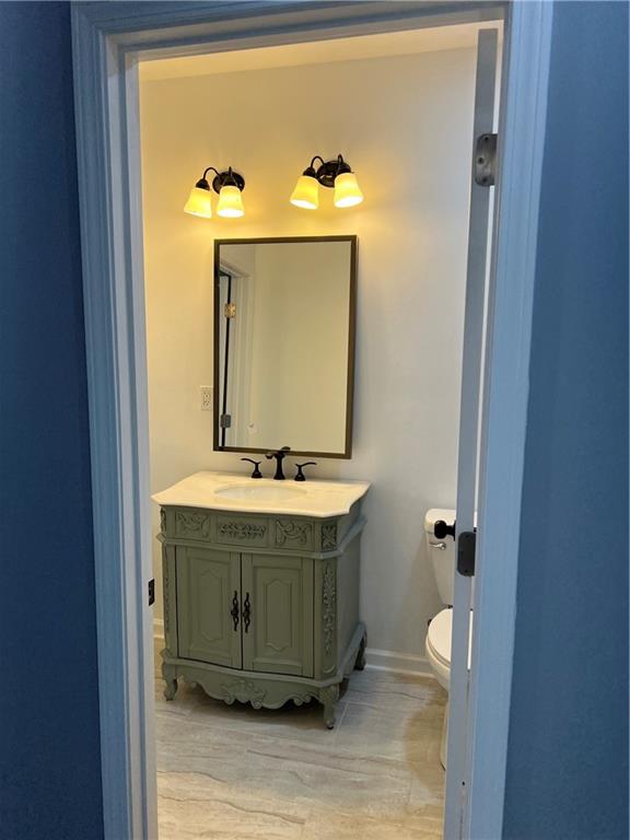 3152 Daleview Way Southwest Atlanta, GA 30331 - Photo 28 of 35 a bathroom with a sink and mirror