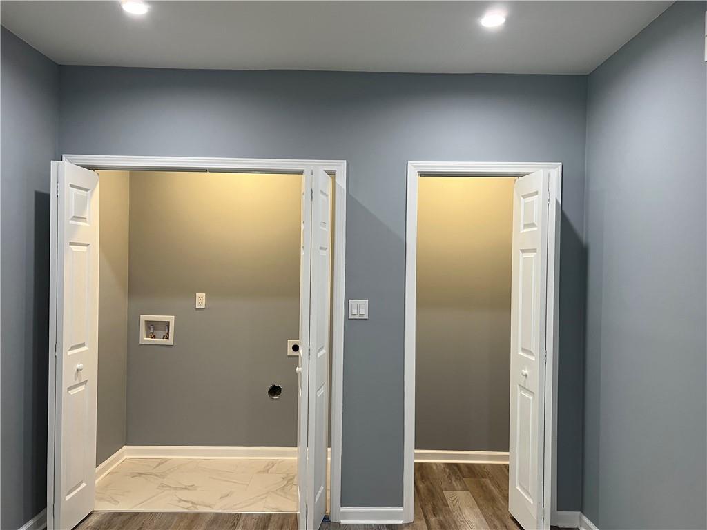 3152 Daleview Way Southwest Atlanta, GA 30331 - Photo 34 of 35 a bathroom with a glass shower door