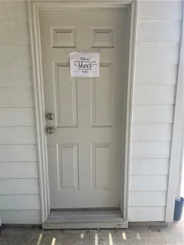 a view of a entryway with wooden floor