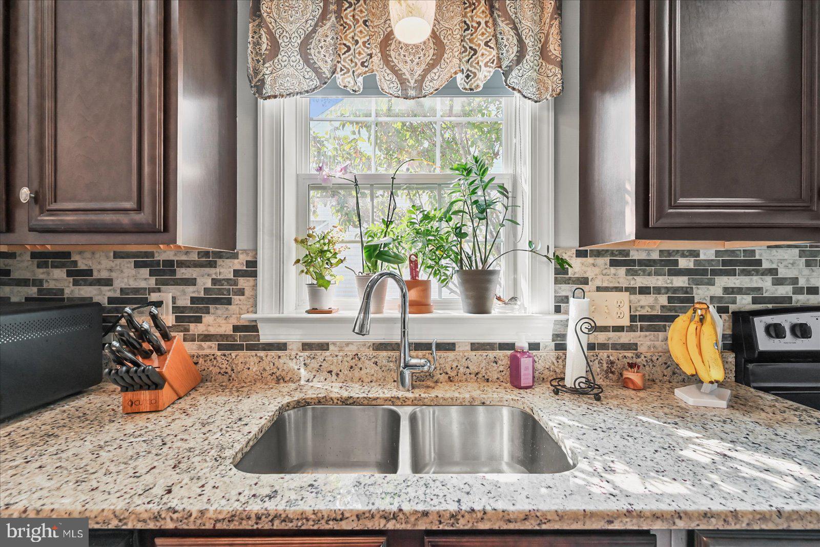 80 Evan Drive York, PA 17404 - Photo 11 of 37 a kitchen with granite countertop a sink and a window