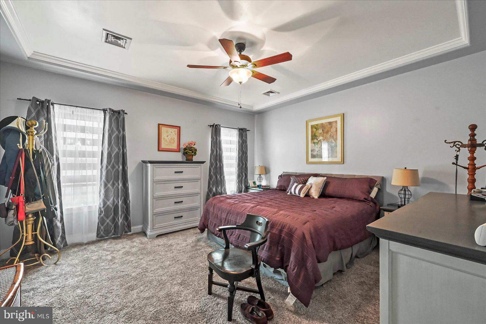 80 Evan Drive York, PA 17404 - Photo 19 of 37 a bedroom with a bed and a chandelier