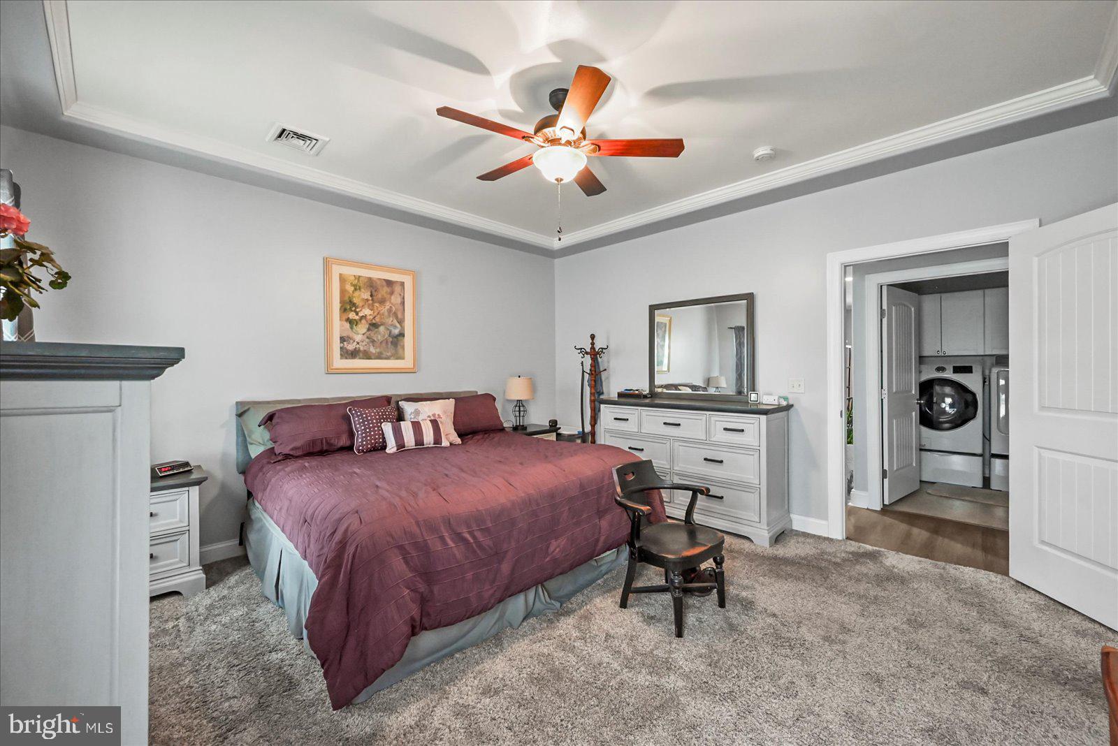 80 Evan Drive York, PA 17404 - Photo 20 of 37 a bedroom with a bed and a chandelier