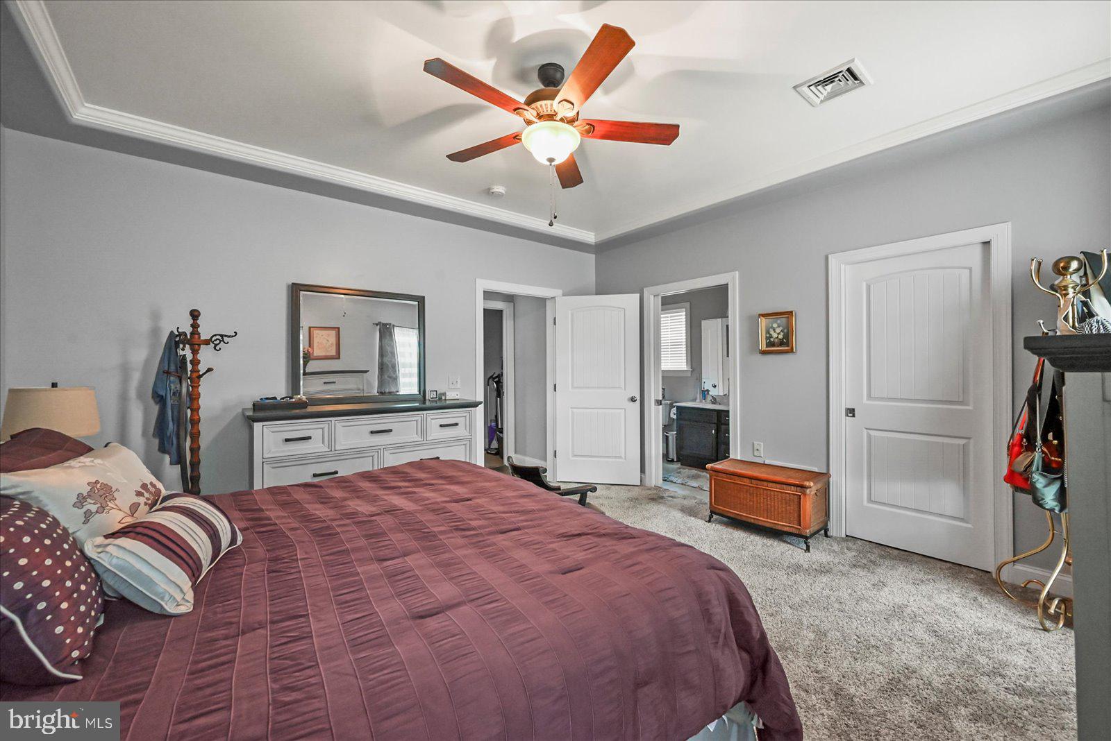 80 Evan Drive York, PA 17404 - Photo 21 of 37 a bedroom with a bed and a chandelier