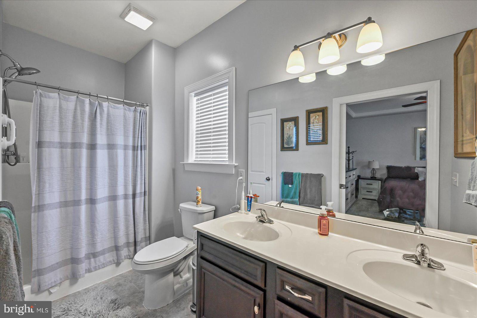 80 Evan Drive York, PA 17404 - Photo 22 of 37 a bathroom with a sink double vanity and a toilet