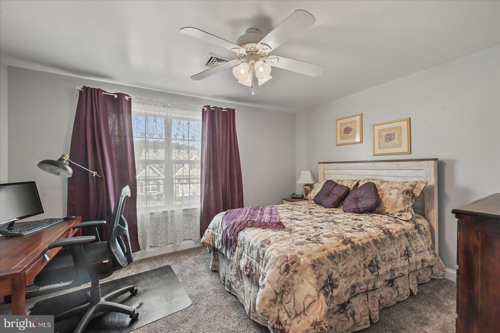 80 Evan Drive York, PA 17404 - Photo 26 of 37 a bedroom with a large bed and a window