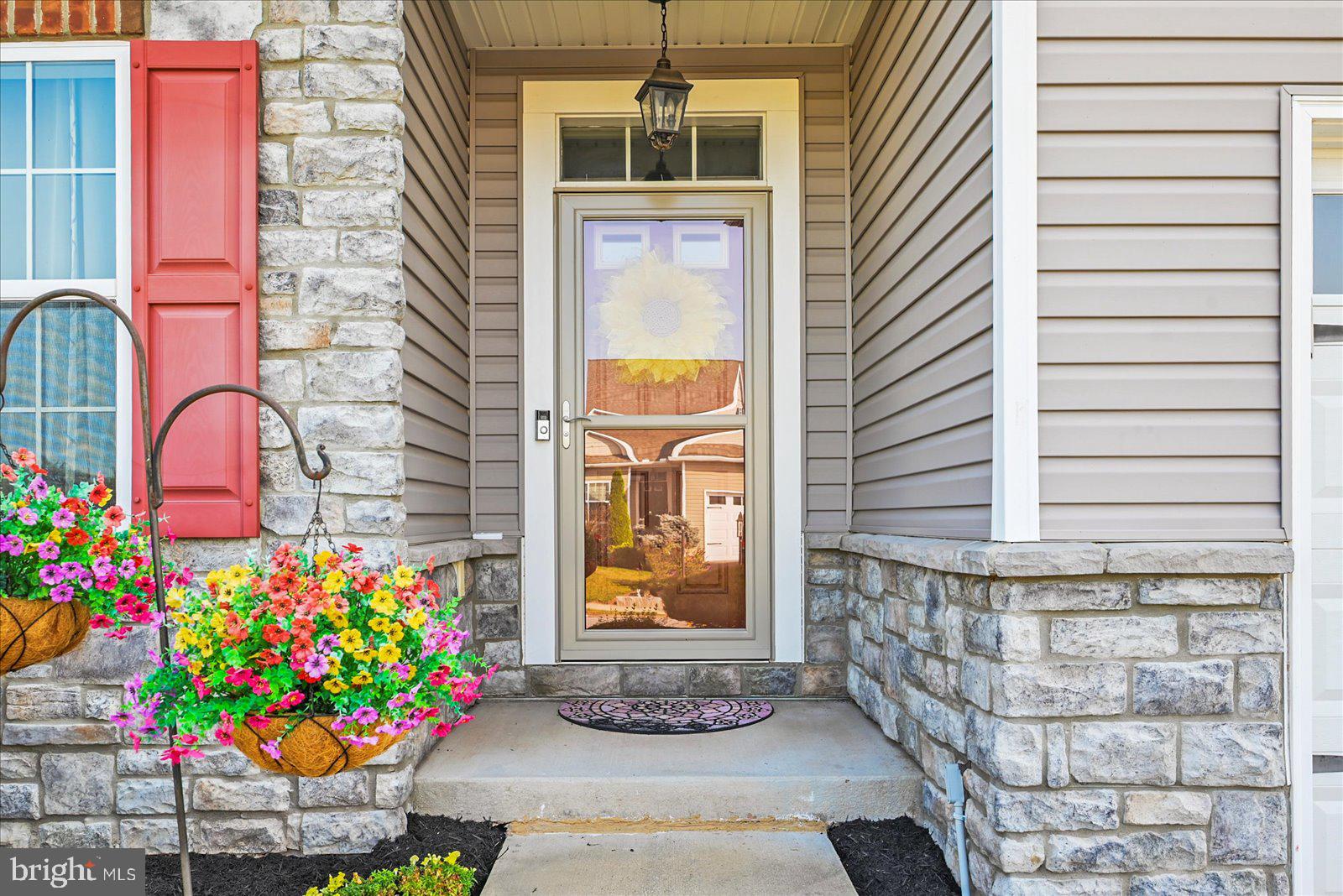80 Evan Drive York, PA 17404 - Photo 5 of 37 a front view of a house with dishwasher and flowers