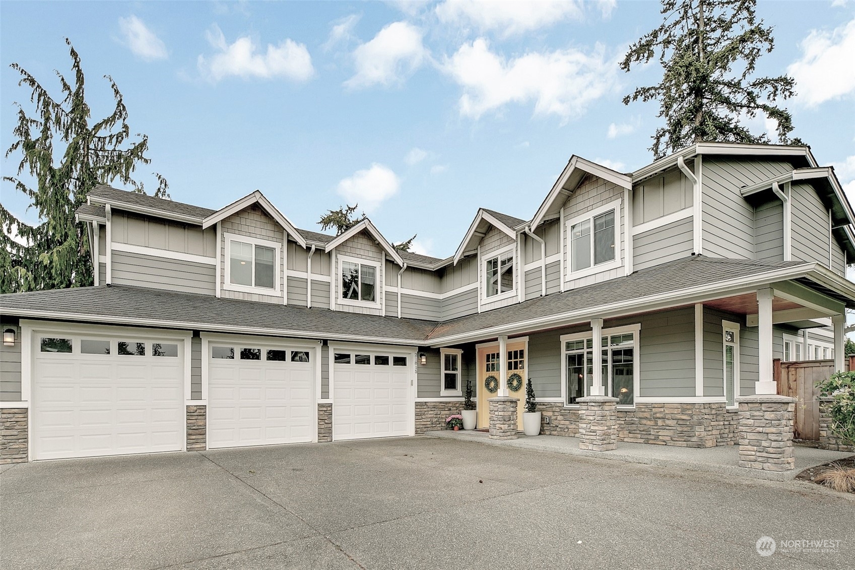 21815 86th Place West Edmonds, WA 98026 - Photo 1 of 25 a front view of a house with a garden and entryway