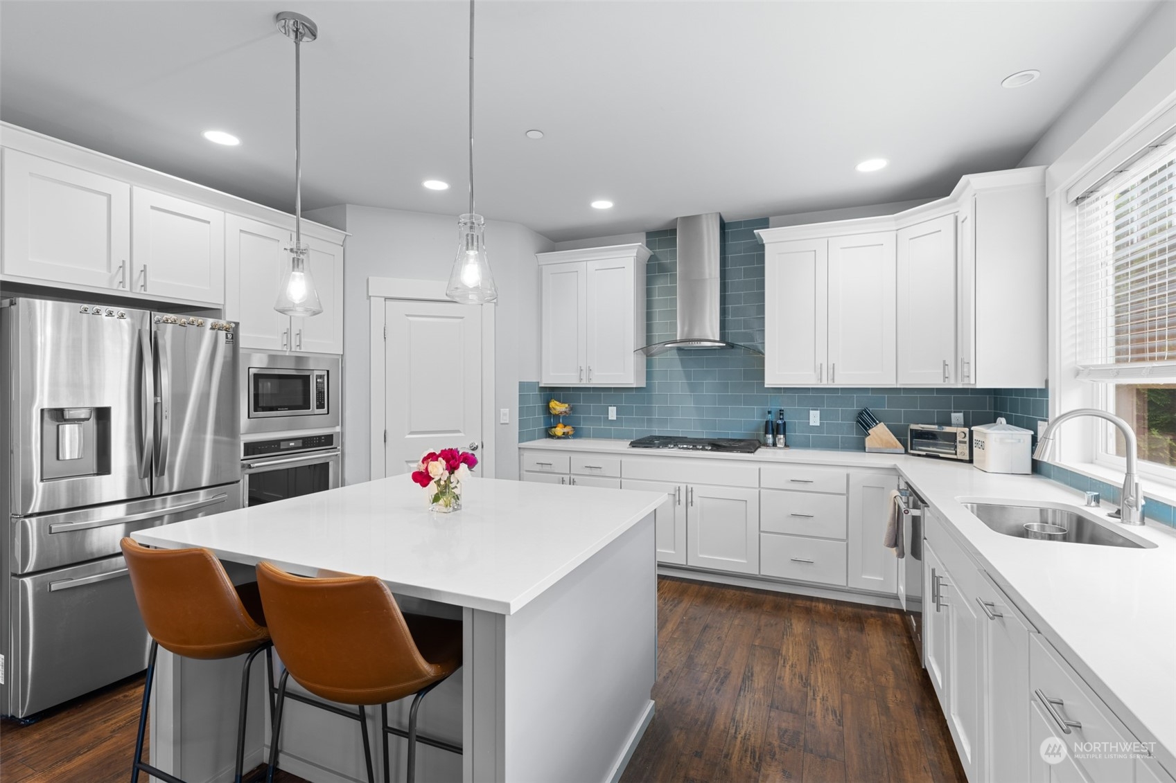 21815 86th Place West Edmonds, WA 98026 - Photo 12 of 25 a kitchen with a refrigerator a sink and white cabinets