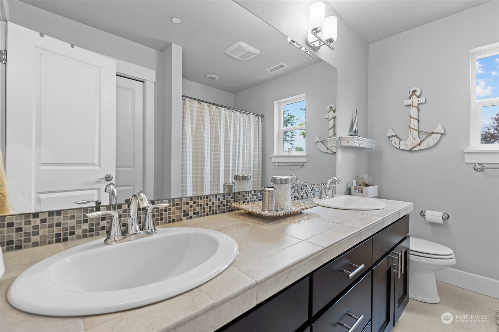 21815 86th Place West Edmonds, WA 98026 - Photo 20 of 25 a bathroom with a double vanity sink and a mirror