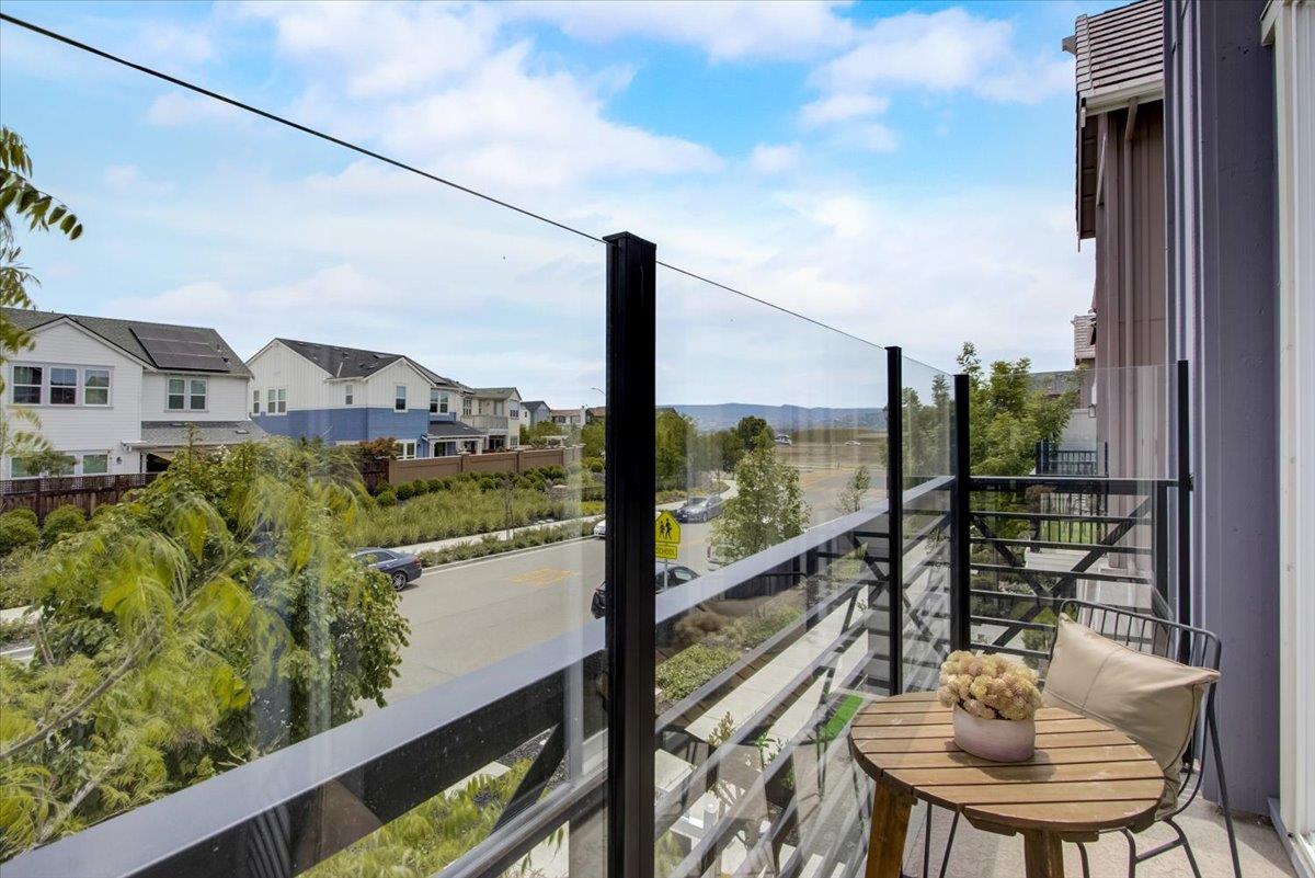 4132 Panorama Drive Dublin, CA 94568 - Photo 20 of 53 a view of a balcony with chair and a floor to ceiling window