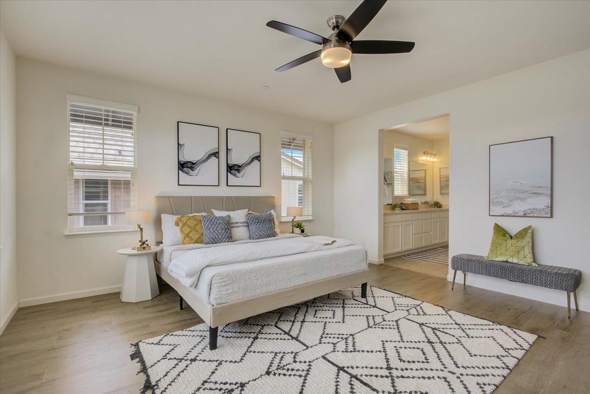 4132 Panorama Drive Dublin, CA 94568 - Photo 22 of 53 a spacious bedroom with a bed and a chandelier