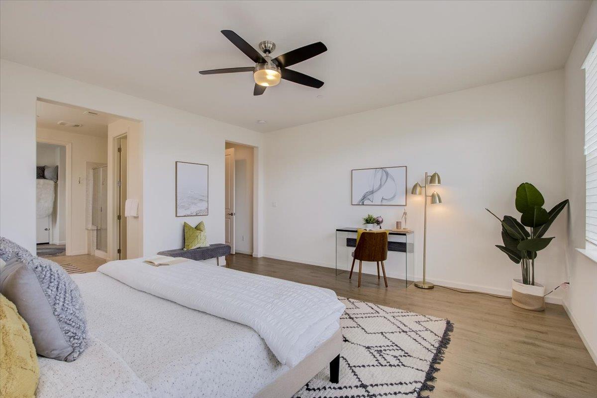 4132 Panorama Drive Dublin, CA 94568 - Photo 24 of 53 a bedroom with a bed and a chandelier