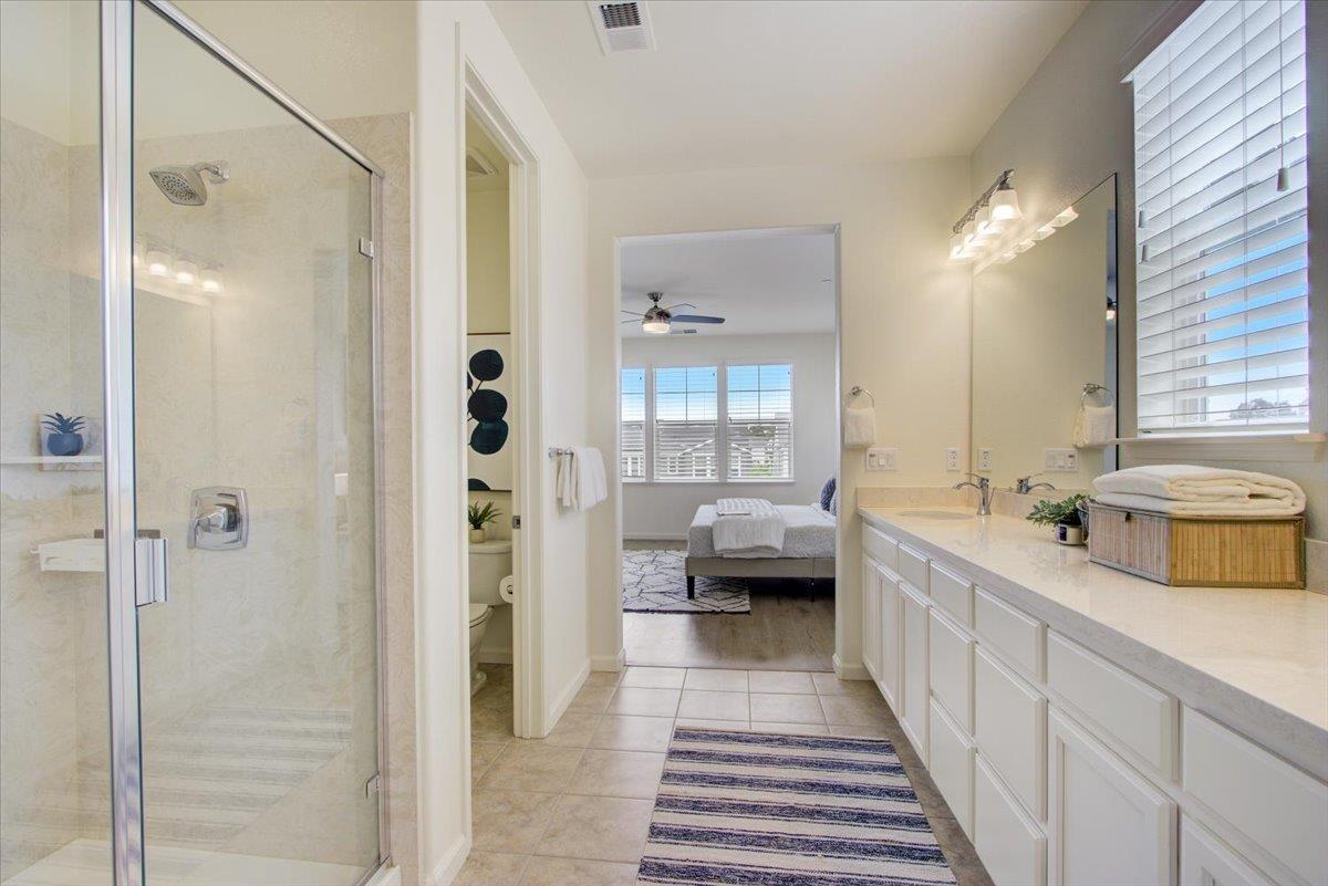 4132 Panorama Drive Dublin, CA 94568 - Photo 27 of 53 a bathroom with a double vanity sink and mirror