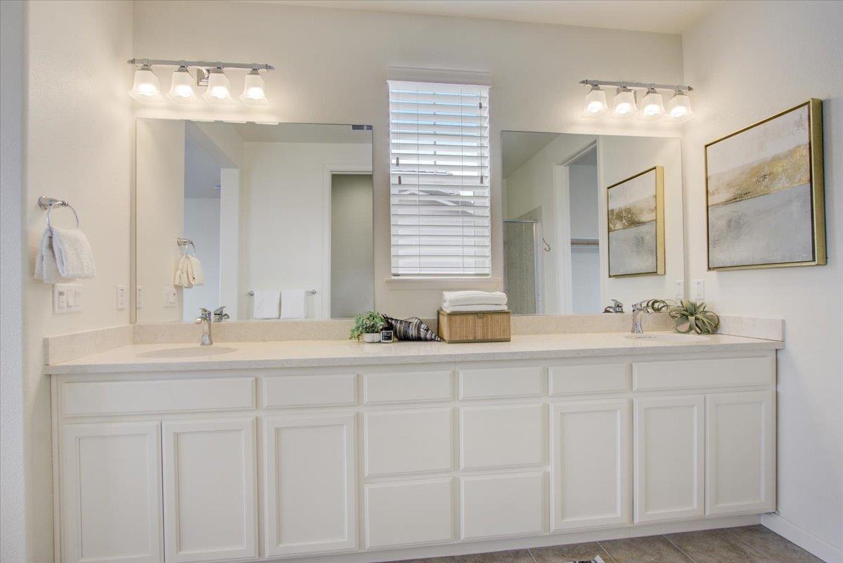 4132 Panorama Drive Dublin, CA 94568 - Photo 28 of 53 a bathroom with double sink and a mirror