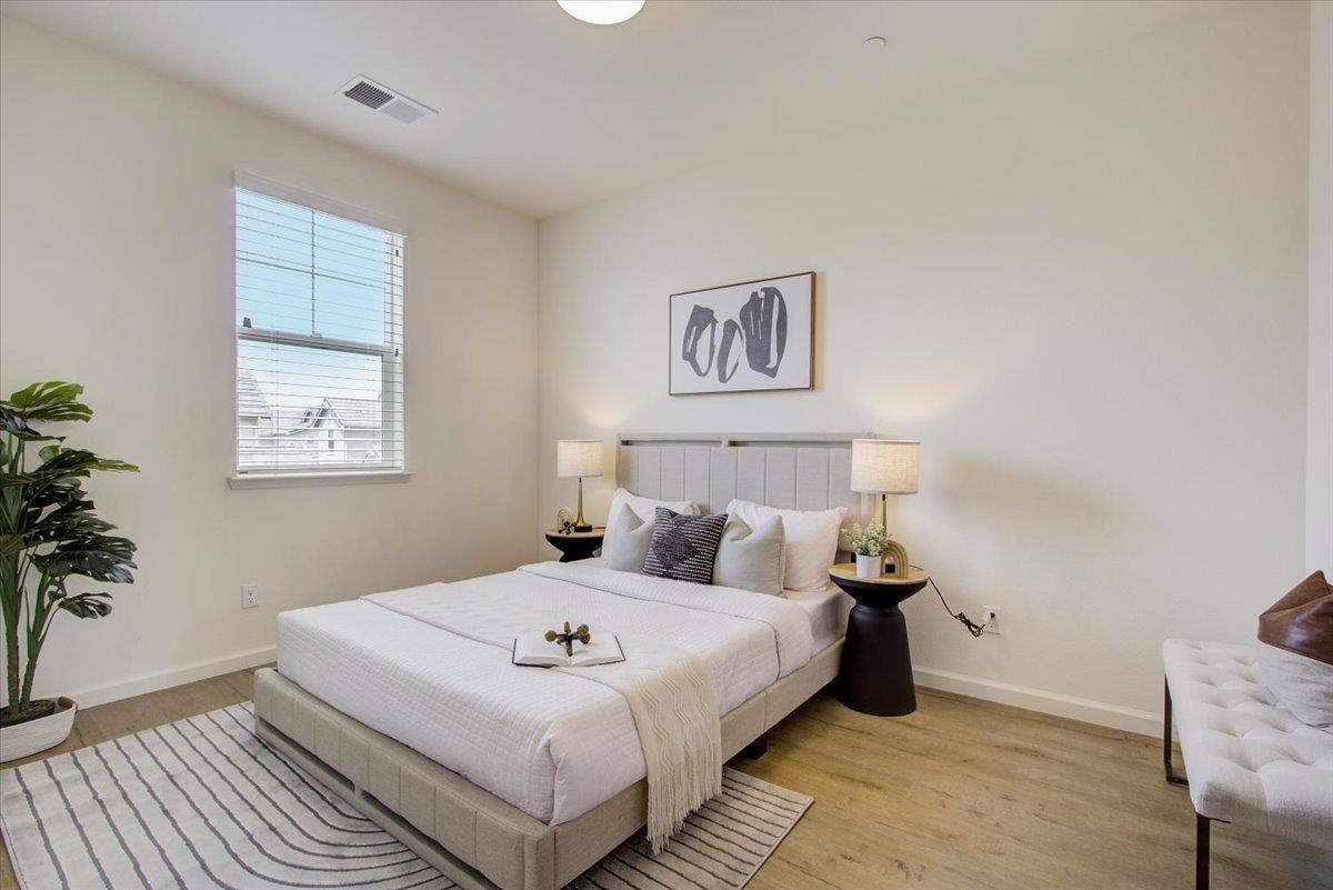 4132 Panorama Drive Dublin, CA 94568 - Photo 34 of 53 a bedroom with a bed and a potted plant