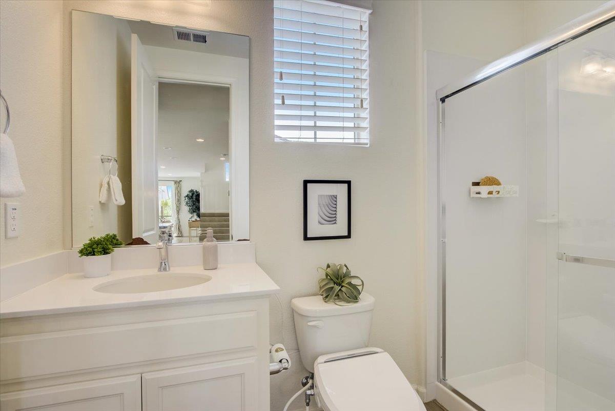 4132 Panorama Drive Dublin, CA 94568 - Photo 36 of 53 a bathroom with a toilet a sink and a mirror