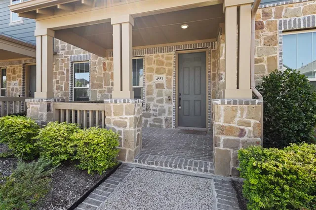 front view of a house with a garden