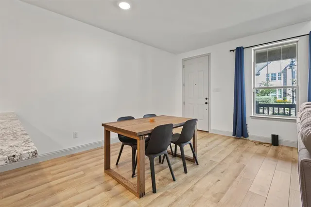 a view of a workspace with furniture and window