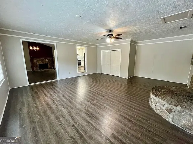 a view of a livingroom with wooden floor