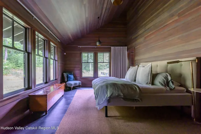 a view of a livingroom with furniture and windows