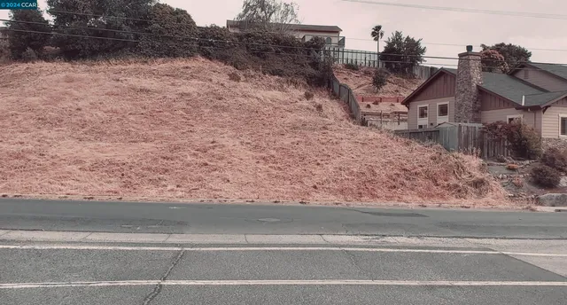 a view of a house with a snow on the road