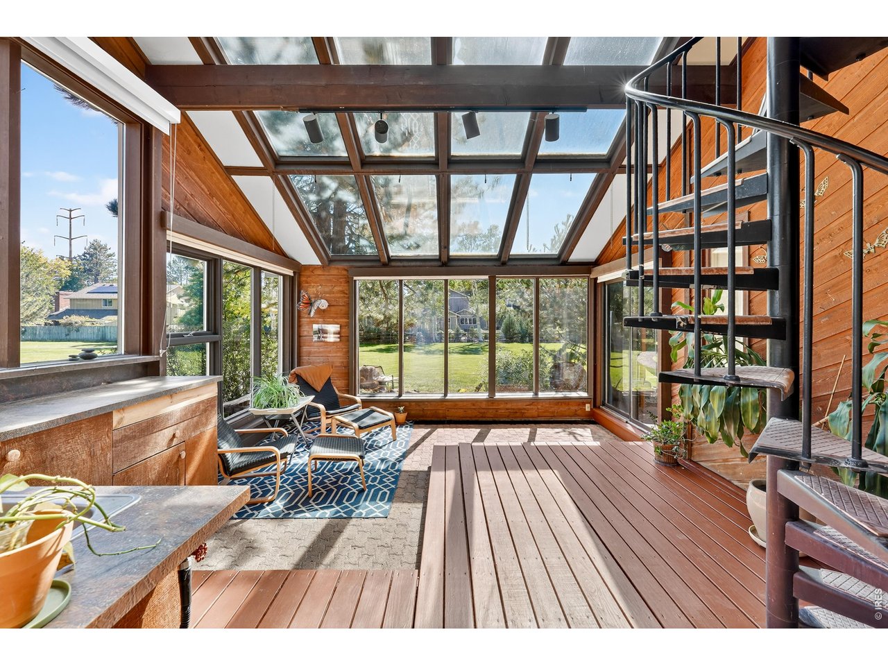 4935 Sundance Square Boulder, CO 80301 - Photo 7 of 49 Soaring vaulted ceilings and skylights pair with southern-facing Marvin windows to create bright, sun-drenched living areas.