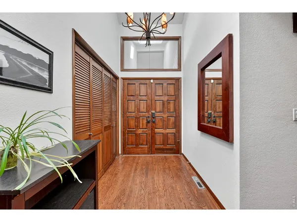 a view of a livingroom with furniture and hardwood floor