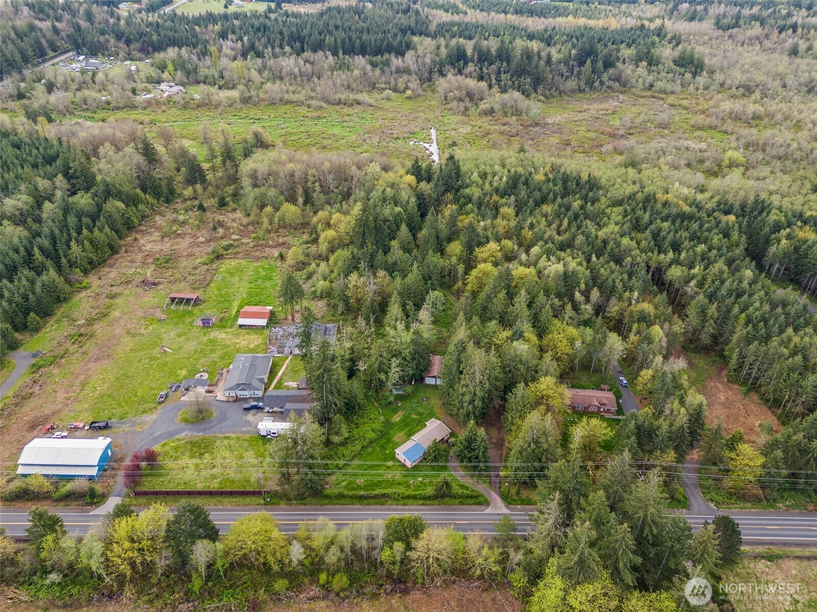 225 West Avery Road Winlock, WA 98596 - Photo 2 of 18 an aerial view of residential houses with outdoor space and trees