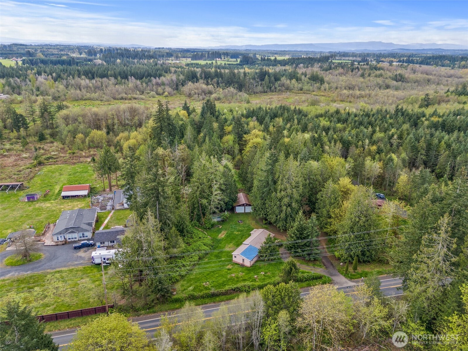 225 West Avery Road Winlock, WA 98596 - Photo 7 of 18 a view of a lake with beach and mountain view