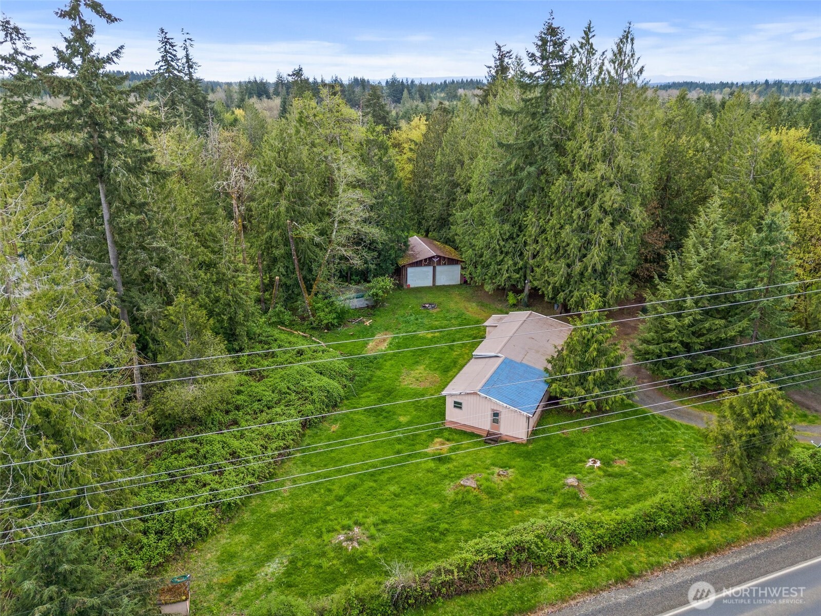 225 West Avery Road Winlock, WA 98596 - Photo 8 of 18 an aerial view of a house with a yard
