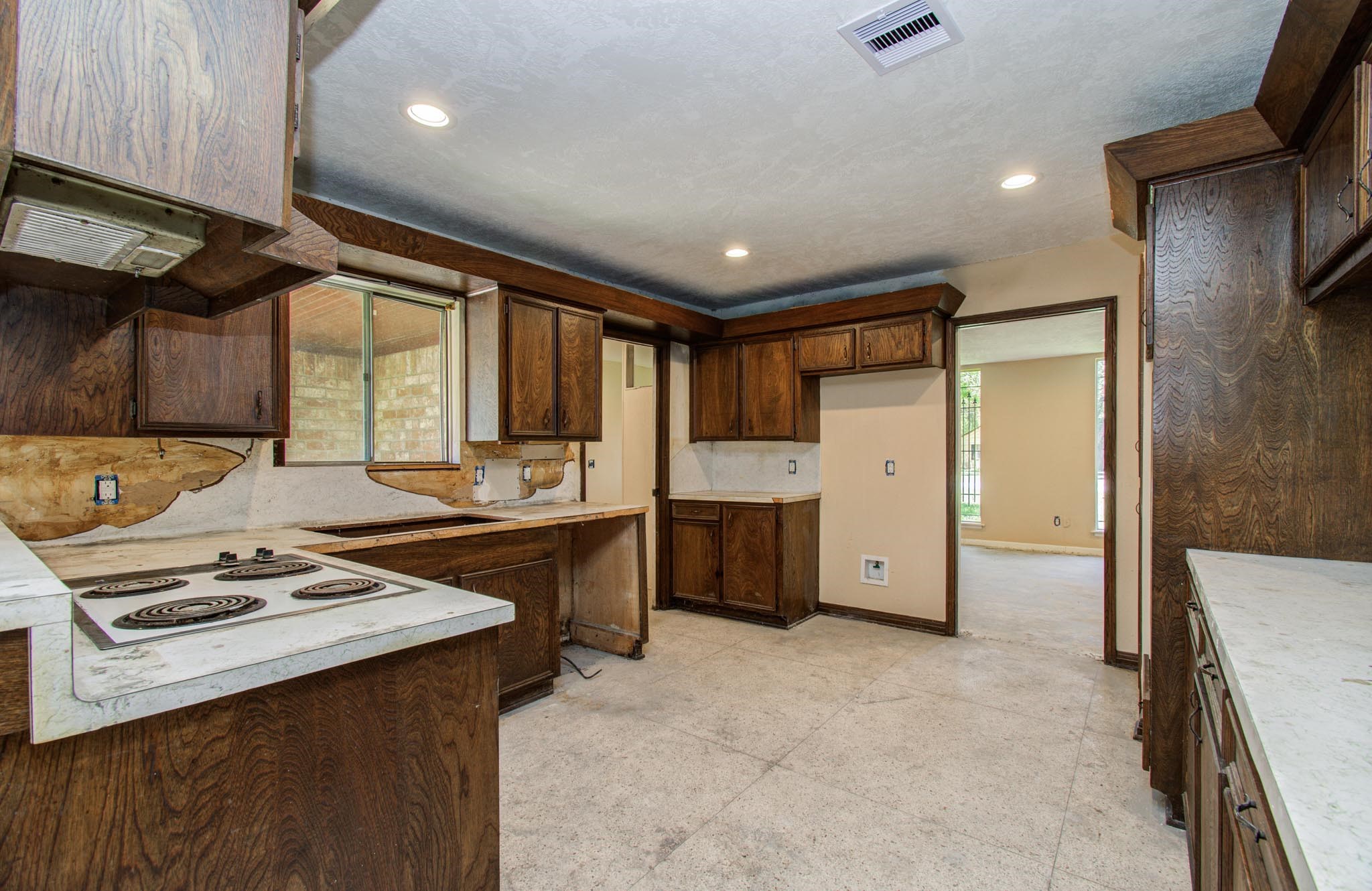 1002 Warwick Street Eagle Lake, TX 77434 - Photo 11 of 29 a kitchen with stainless steel appliances a stove cabinets and wooden floor