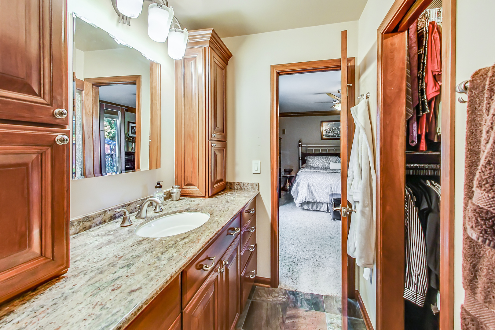 224 Perth Road Cary, IL 60013 - Photo 18 of 39 a en suite bathroom with a granite countertop sink and a mirror