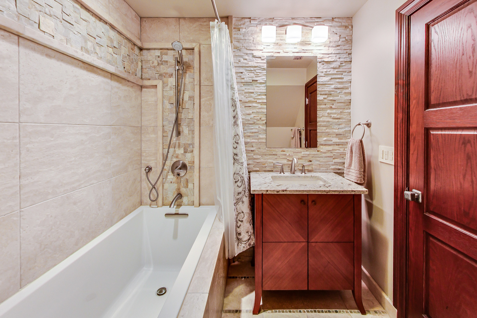 224 Perth Road Cary, IL 60013 - Photo 25 of 39 a bathroom with a tub a sink and a shower
